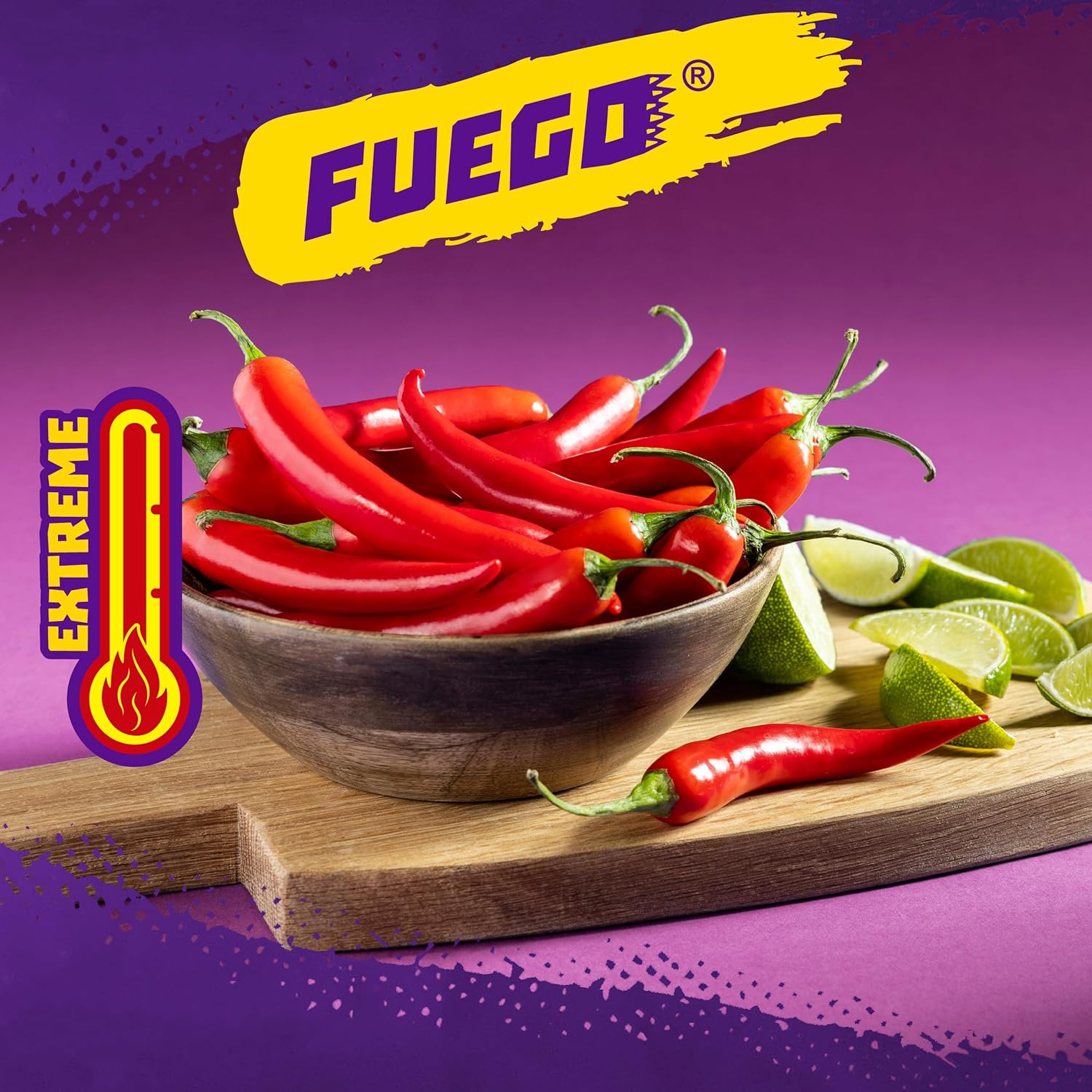 Bowl of Takis fuego red chili peppers with lime wedges on a wooden board, Fuego brand logo above.