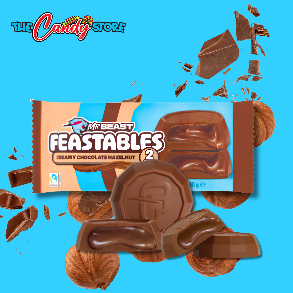A MrBeast Feastables chocolate bar package on a bright blue background with scattered chocolate pieces and hazelnuts.