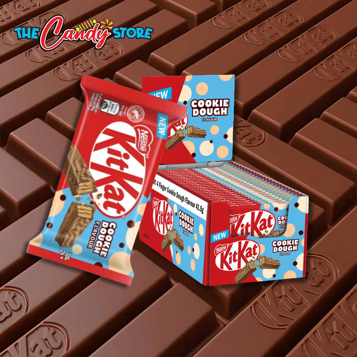 KitKat Cookie Dough chocolate bars shown as a single wrapped pack and a large box of KitKat Cookie Dough bars, arranged on a background of KitKat bar pieces. 